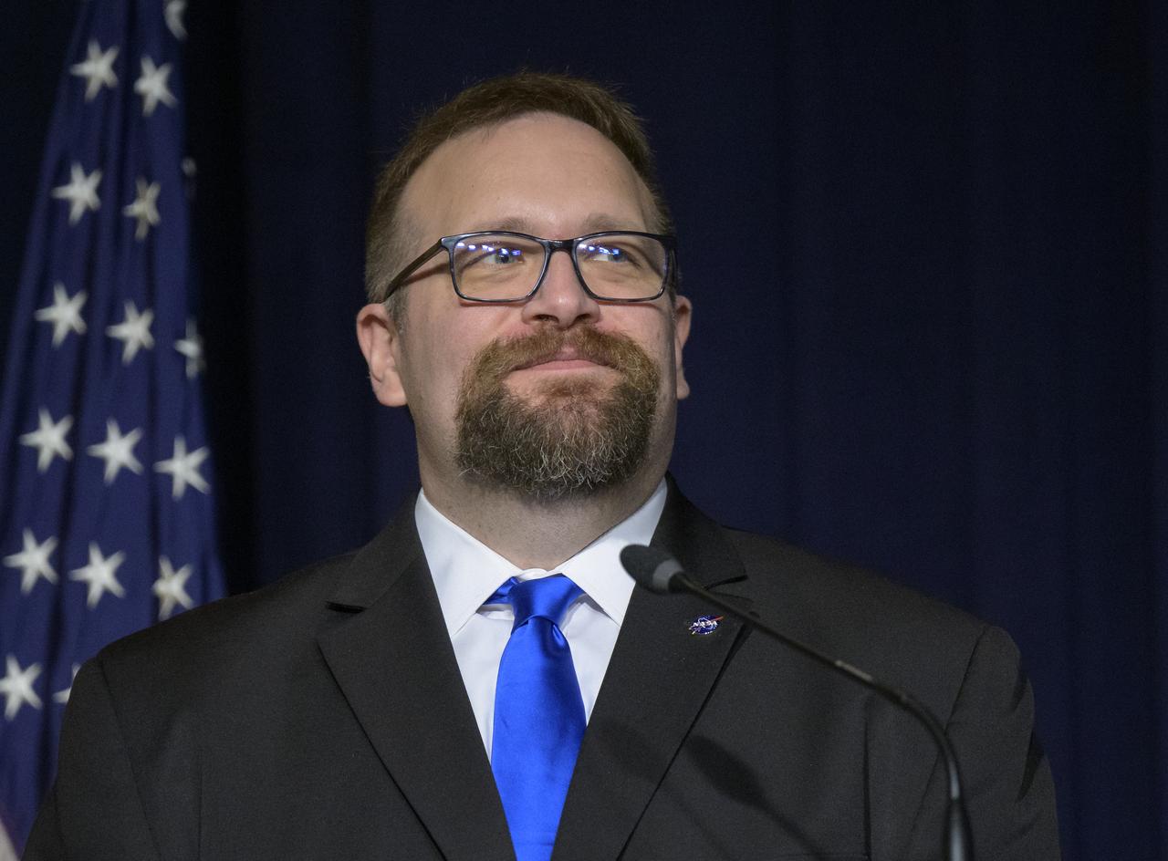 NASA Disaster Response Coordination System Manager Joshua Barnes delivers remarks during an event launching a new Disaster Response Coordination System that will provide communities and organizations around the world with access to science and data to aid disaster response, Thursday, June 13, 2024, at the NASA Headquarters Mary W. Jackson Building in Washington. Photo Credit: (NASA/Bill Ingalls)