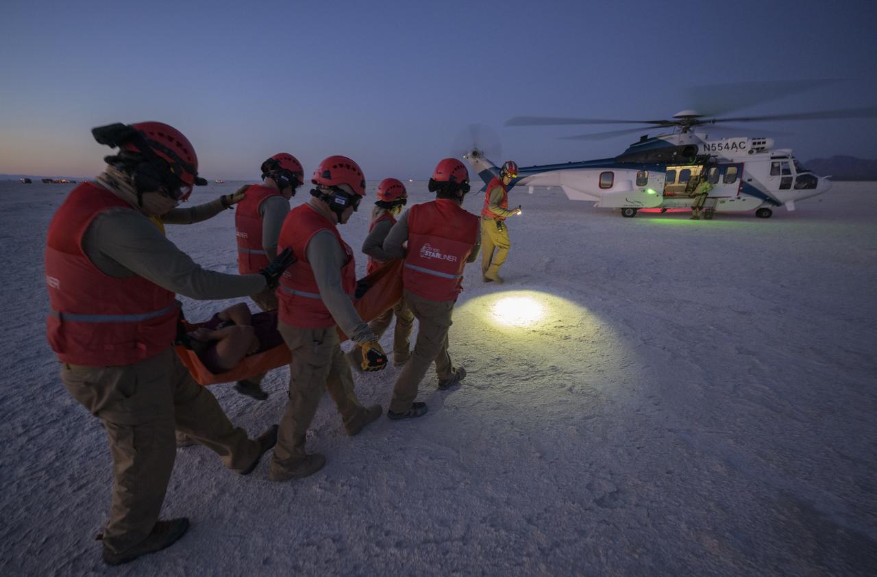 Boeing and NASA teams participate in a mission dress rehearsal to prepare for the landing of the Boeing CST-100 Starliner spacecraft in White Sands, New Mexico, Sunday, June 16, 2024. During the dry-run, teams practice assisting astronauts that might need time to be re-acclimated to Earth’s gravity before walking. NASA astronauts Butch Wilmore and Suni Williams are Starliner’s first human crew and travelled to the International Space Station as part of NASA's Boeing Crew Flight Test. The mission serves as an end-to-end demonstration of Boeing’s crew transportation system as a provider for NASA’s Commercial Crew Program. Photo Credit: (NASA/Bill Ingalls)