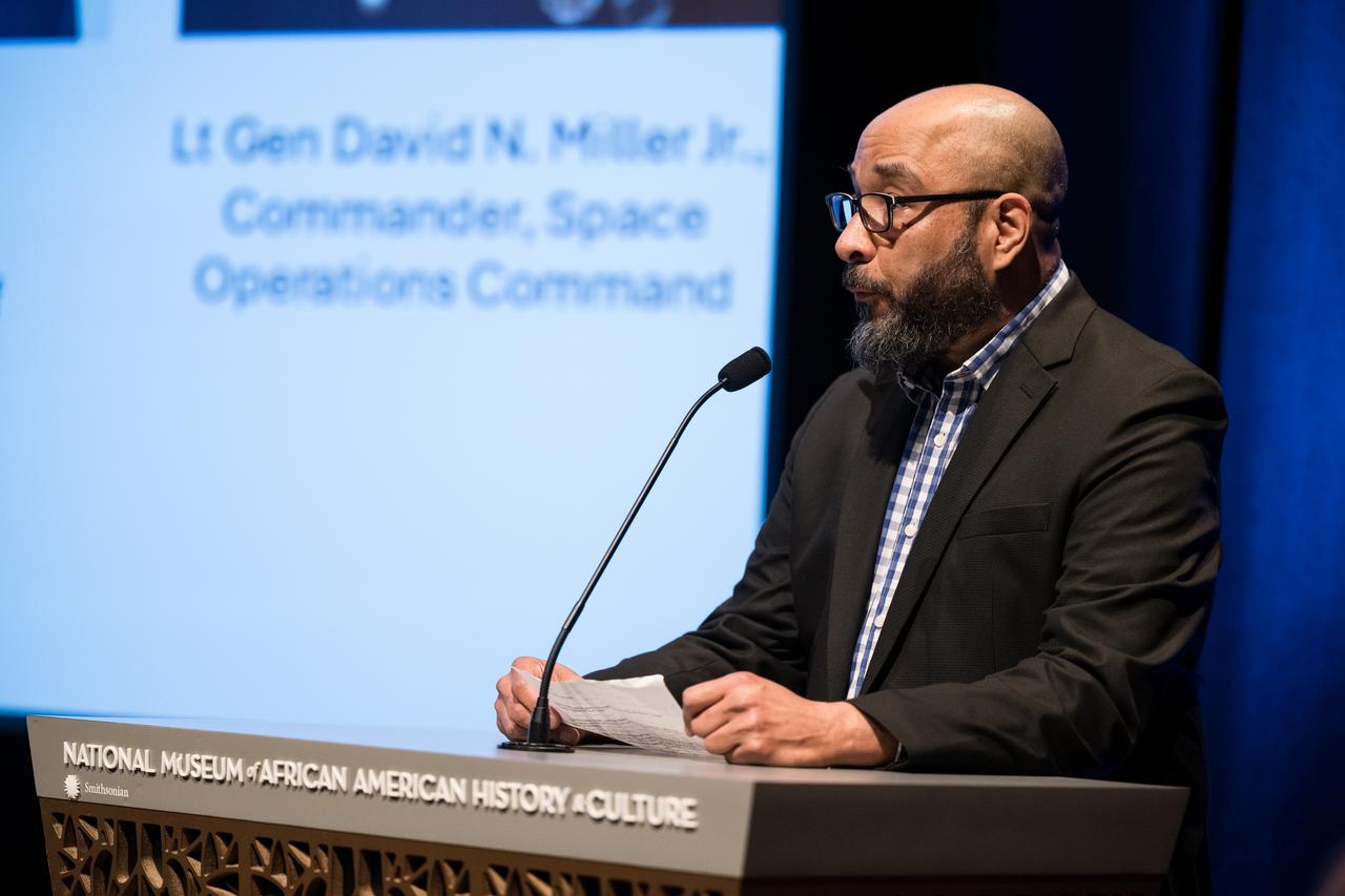 Dr. Kevin Strait, curator of history, National Museum of African American History and Culture (NMAAHC), speaks at an event to commemorate Black Space Week (BSW) 2024 titled, "Beyond the Color Lines From Science Fiction to Science Fact," in the Oprah Winfrey Theater at the Smithsonian National Museum of African American History and Culture, Monday, June 17, 2024 in Washington. Photo Credit: (NASA/Aubrey Gemignani)