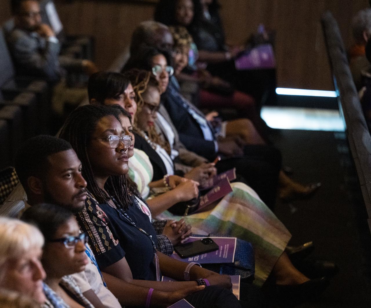 Audience members are seen as Don Graves, deputy secretary, U.S. Department of Commerce, speaks at an event to commemorate Black Space Week (BSW) 2024 titled, "Beyond the Color Lines From Science Fiction to Science Fact," in the Oprah Winfrey Theater at the Smithsonian National Museum of African American History and Culture, Monday, June 17, 2024 in Washington. Photo Credit: (NASA/Aubrey Gemignani)