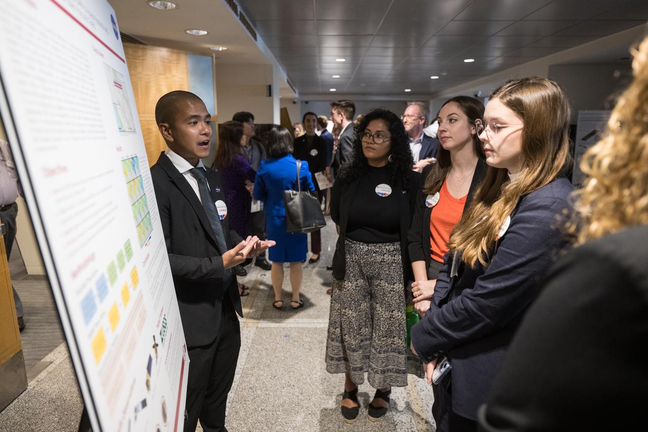 A DEVELOP researcher speaks about his project, Tuesday, August 6, 2024, at the Mary W. Jackson NASA Headquarters building in Washington. Every summer early career researchers from NASA’s DEVELOP National Program come to NASA Headquarters and present their research projects. DEVELOP is a training and development program where early career researchers work on Earth science projects, mentored by science advisors from NASA and partner agencies, and provide research results to local communities. Photo Credit: (NASA/Aubrey Gemignani)