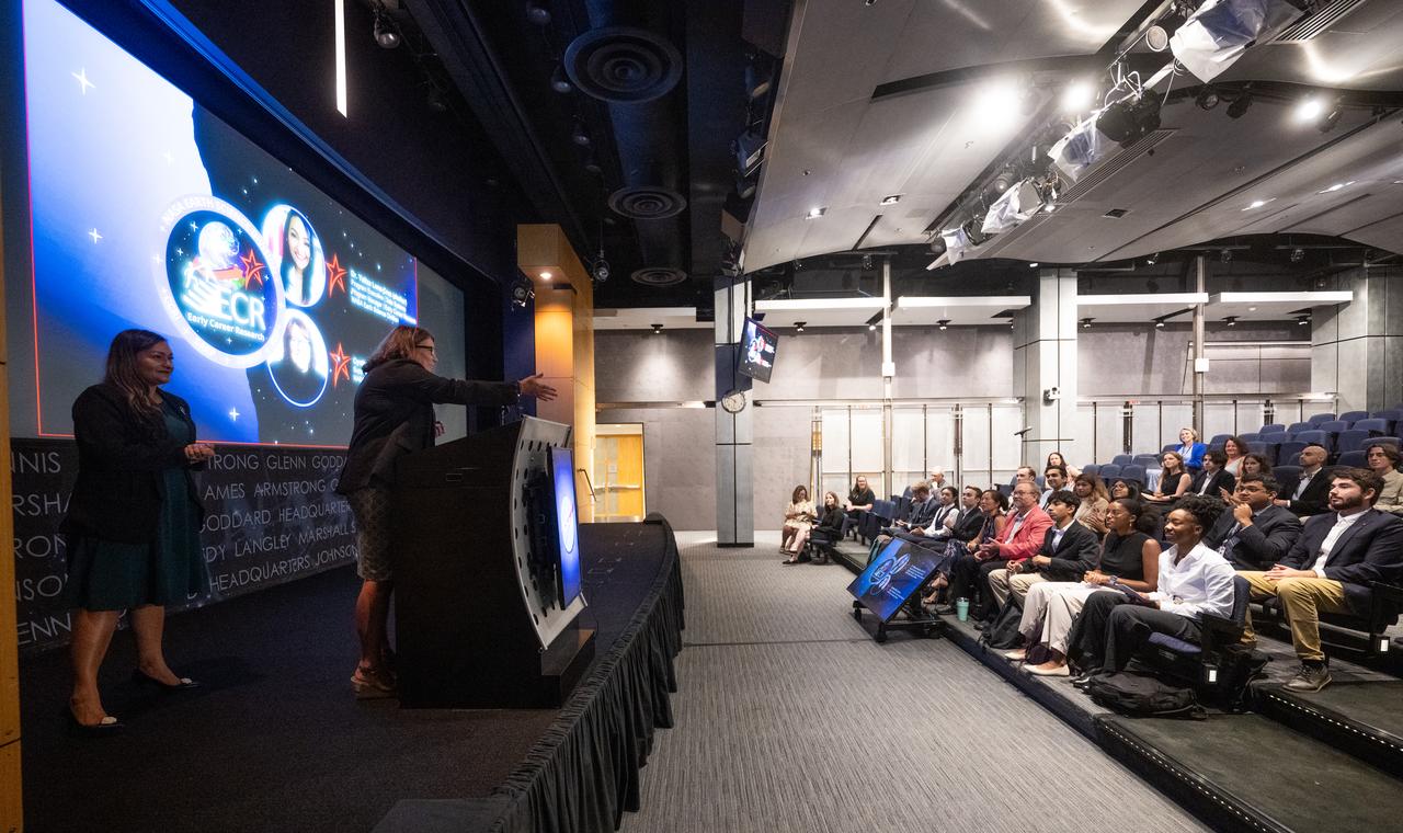 Cynthia Hall, support scientist for the Early Career Research Program in NASA’s Earth Science Division, right, and Yaítza Luna-Cruz, a program executive in the Earth Science Division of NASA’s Science Mission Directorate and program manager for the Early Career Research Program speak to the Climate Change Research Initiative (CCRI) cohort, Wednesday, Aug. 7, 2024, at the Mary W. Jackson NASA Headquarters building in Washington, DC. The Earth Science Division’s Early Career Research Program’s Climate Change Research Initiative (CCRI) is a year-long STEM engagement and experiential learning opportunity for educators and students from high school to graduate level. Photo Credit: (NASA/Joel Kowsky)