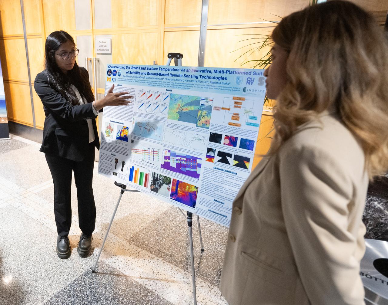 Members of the Climate Change Research Initiative (CCRI) cohort discuss their research during a poster session, Wednesday, Aug. 7, 2024, at the Mary W. Jackson NASA Headquarters building in Washington, DC. The Earth Science Division’s Early Career Research Program’s Climate Change Research Initiative (CCRI) is a year-long STEM engagement and experiential learning opportunity for educators and students from high school to graduate level. Photo Credit: (NASA/Joel Kowsky)
