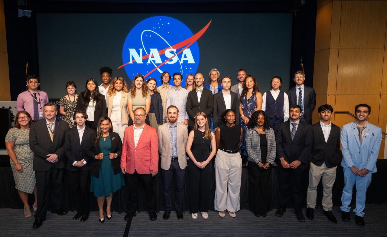 The Climate Change Research Initiative (CCRI) cohort poses for a group photo, Wednesday, Aug. 7, 2024, at the Mary W. Jackson NASA Headquarters building in Washington, DC. The Earth Science Division’s Early Career Research Program’s Climate Change Research Initiative (CCRI) is a year-long STEM engagement and experiential learning opportunity for educators and students from high school to graduate level. Photo Credit: (NASA/Joel Kowsky)