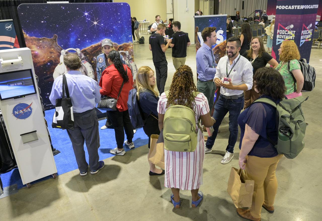 NASA participates in the Podcast Movement conference, Tuesday, Aug. 20, 2024, at the Gaylord National Resort and Convention Center in National Harbor, Md. During the event, NASA hosted a panel entitled, "Eclipses, Moon Missions, and Climate Change: How NASA Reaches Curious Listeners." Photo Credit: (NASA/Bill Ingalls)