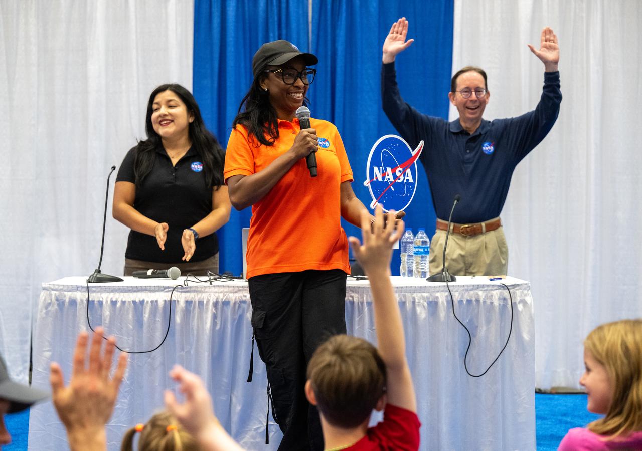 NASA Office of Communications Agency Lead Lisa Frazier, center, introduces NASA Science Mission Directorate Program Executive Rosa Avalos-Warren, left, and NASA Science Mission Directorate Astrophysicist Dominic Bedford, right, prior to their presentations during the Library of Congress National Book Festival Saturday, Aug. 24, 2024, at the Walter E. Washington Convention Center in Washington. Photo Credit: (NASA/Keegan Barber)