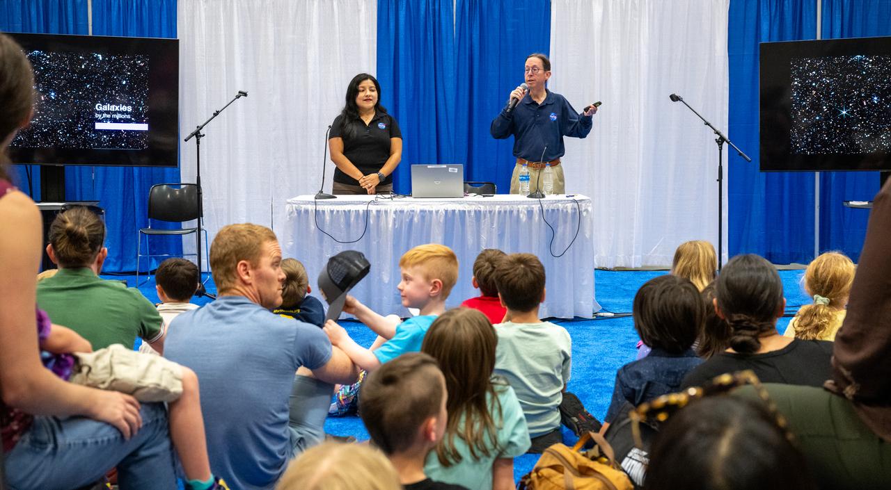 NASA Science Mission Directorate Astrophysicist Dominic Bedford, right, delivers remarks during the Library of Congress National Book Festival Saturday, Aug. 24, 2024, at the Walter E. Washington Convention Center in Washington. Photo Credit: (NASA/Keegan Barber)