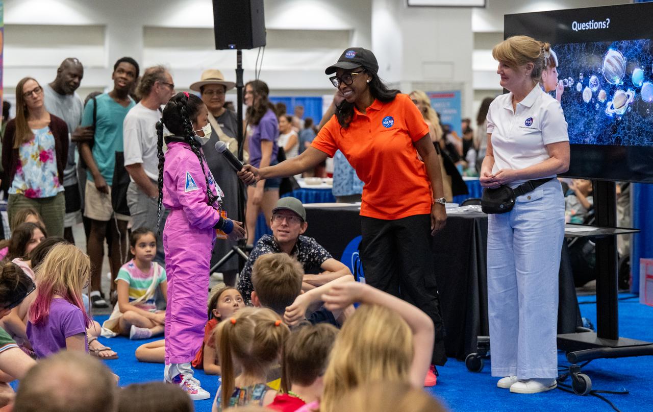 Guests ask questions following presentations by NASA Science Mission Directorate Program Executive Rosa Avalos-Warren and NASA Science Mission Directorate Astrophysicist Dominic Bedford during the Library of Congress National Book Festival Saturday, Aug. 24, 2024, at the Walter E. Washington Convention Center in Washington. Photo Credit: (NASA/Keegan Barber)