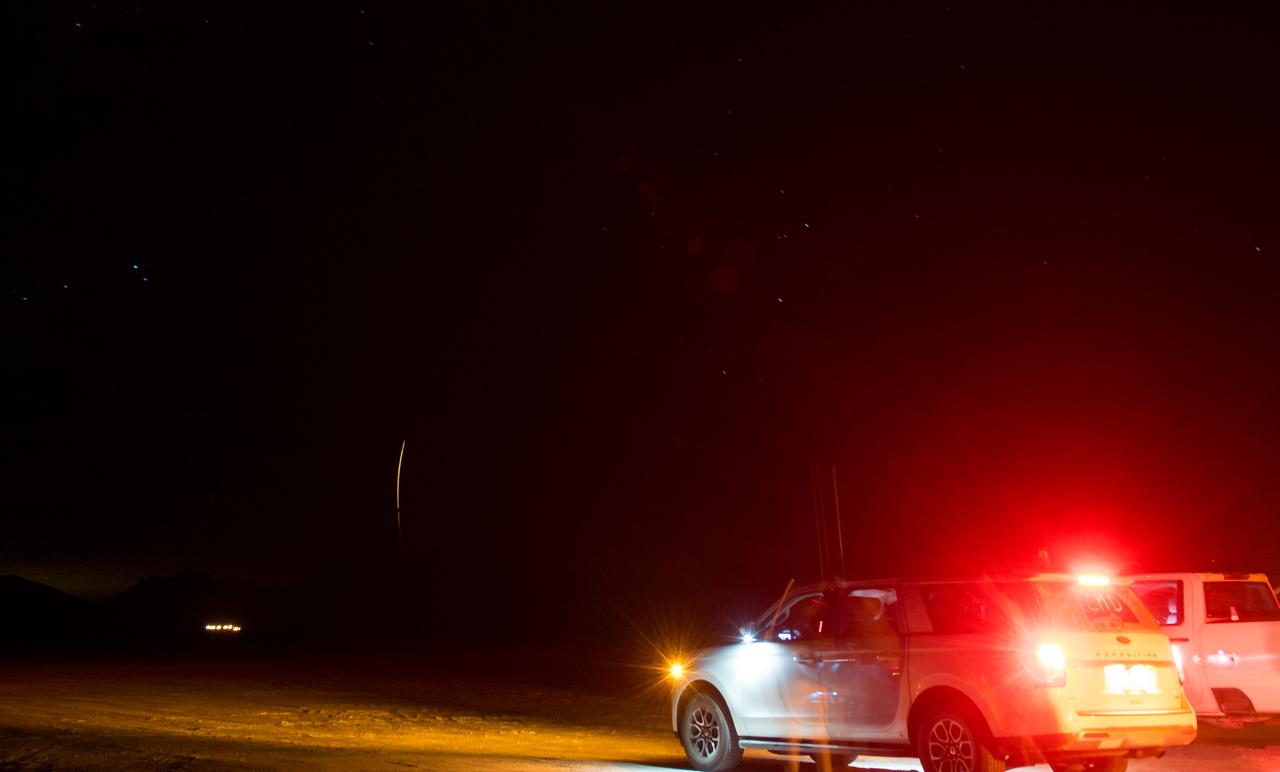 In this 30-second exposure, NASA's Boeing Crew Flight Test Starliner spacecraft lands uncrewed, Friday, Sept. 6, 2024, at White Sands, New Mexico. This approach allows NASA and Boeing to continue gathering testing data on the spacecraft. Photo Credit: (NASA/Aubrey Gemignani)