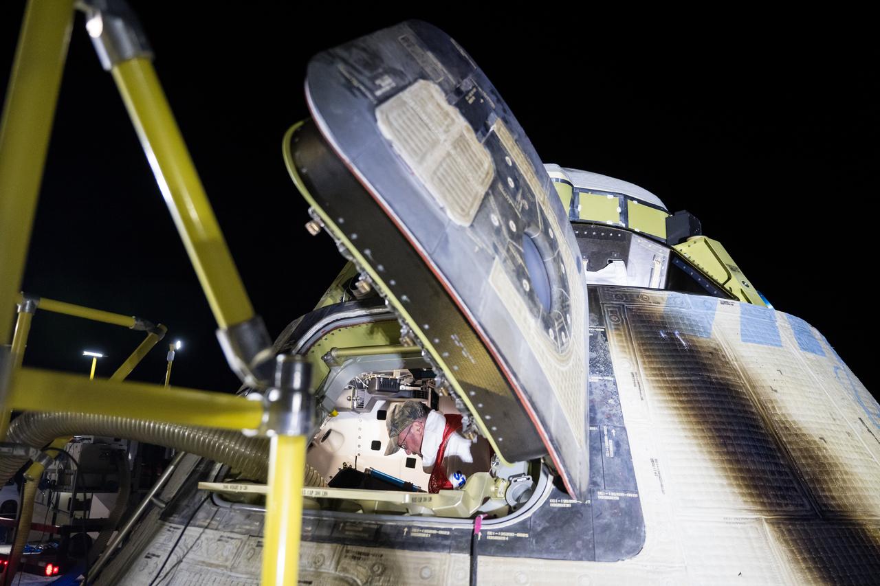 Boeing and NASA teams unload cargo from NASA's Boeing Crew Flight Test Starliner spacecraft after it landed uncrewed at White Sands Missile Range’s Space Harbor, Friday, Sept. 6, 2024 Mountain Time (Sept. 7 Eastern Time), in New Mexico. This approach allows NASA and Boeing to continue gathering testing data on the spacecraft. Photo Credit: (NASA/Aubrey Gemignani)