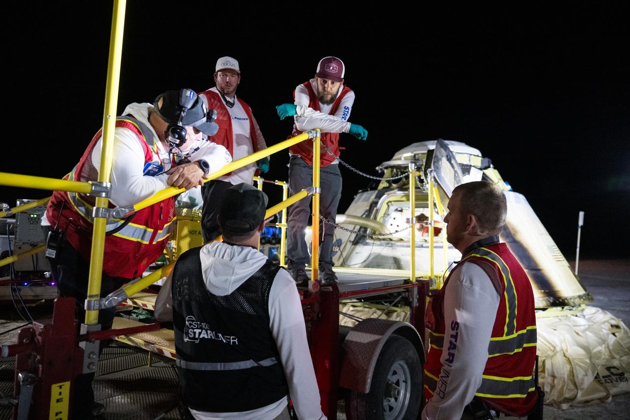 Boeing and NASA teams work around NASA's Boeing Crew Flight Test Starliner spacecraft after it landed uncrewed, Friday, Sept. 6, 2024 Mountain Time (Sept. 7 Eastern Time), at White Sands, New Mexico. This approach allows NASA and Boeing to continue gathering testing data on the spacecraft. Photo Credit: (NASA/Aubrey Gemignani)
