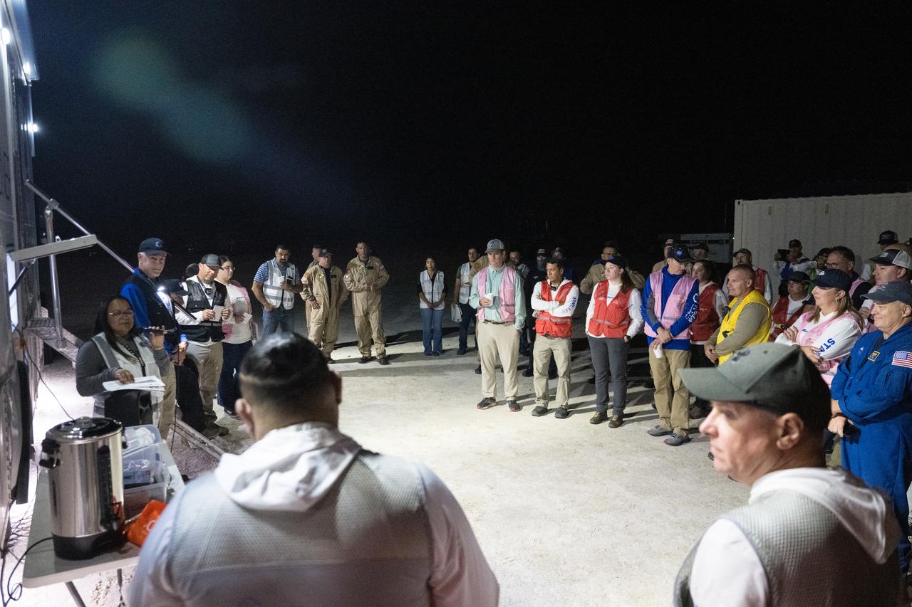Boeing and NASA teams meet before NASA's Boeing Crew Flight Test Starliner spacecraft lands uncrewed, Friday, Sept. 6, 2024 Mountain Time at White Sands, New Mexico. This approach allows NASA and Boeing to continue gathering testing data on the spacecraft. Photo Credit: (NASA/Aubrey Gemignani)