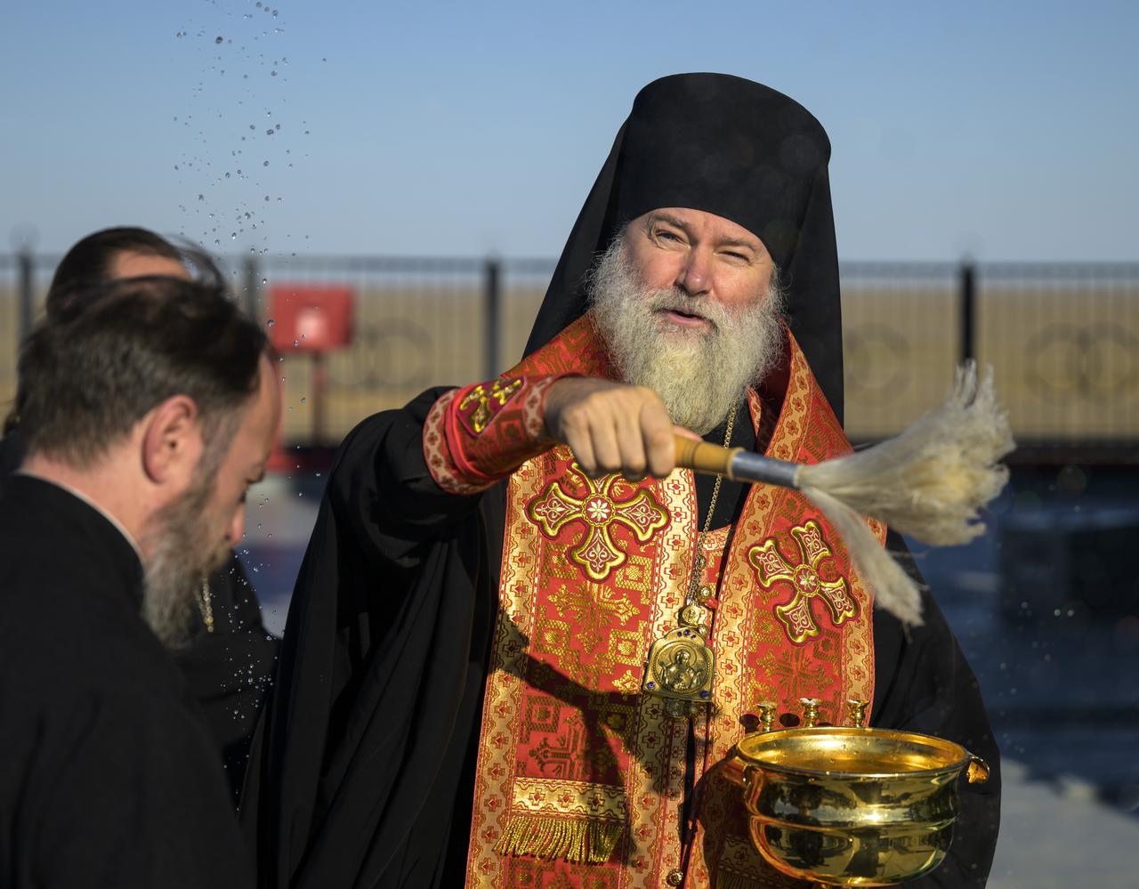 Bishop Ignatii of Kyzylorda and Aktobe gives blessings to personnel and the Soyuz rocket, Tuesday, Sept. 10, 2024, at the Baikonur Cosmodrome site 31 launch in Kazakhstan. Expedition 72 crew members: NASA astronaut Don Pettit, Roscosmos cosmonauts Alexey Ovchinin, and Ivan Vagner, are scheduled to launch aboard their Soyuz MS-26 spacecraft on September 11. Photo Credit: (NASA/Bill Ingalls)
