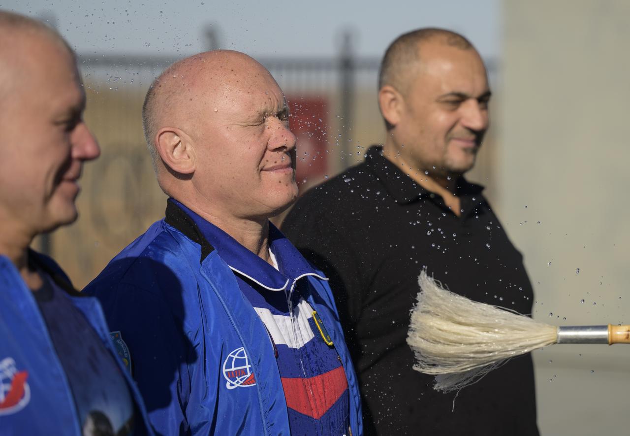 Roscosmos cosmonaut Oleg Artemyev, center, is blessed by Bishop Ignatii of Kyzylorda and Aktobe, during a traditional blessing of the Soyuz rocket and personnel, Tuesday, Sept. 10, 2024, at the at the Baikonur Cosmodrome site 31 launch pad in Kazakhstan. Expedition 72 crew members: NASA astronaut Don Pettit, Roscosmos cosmonauts Alexey Ovchinin, and Ivan Vagner, are scheduled to launch aboard their Soyuz MS-26 spacecraft on September 11. Photo Credit: (NASA/Bill Ingalls)