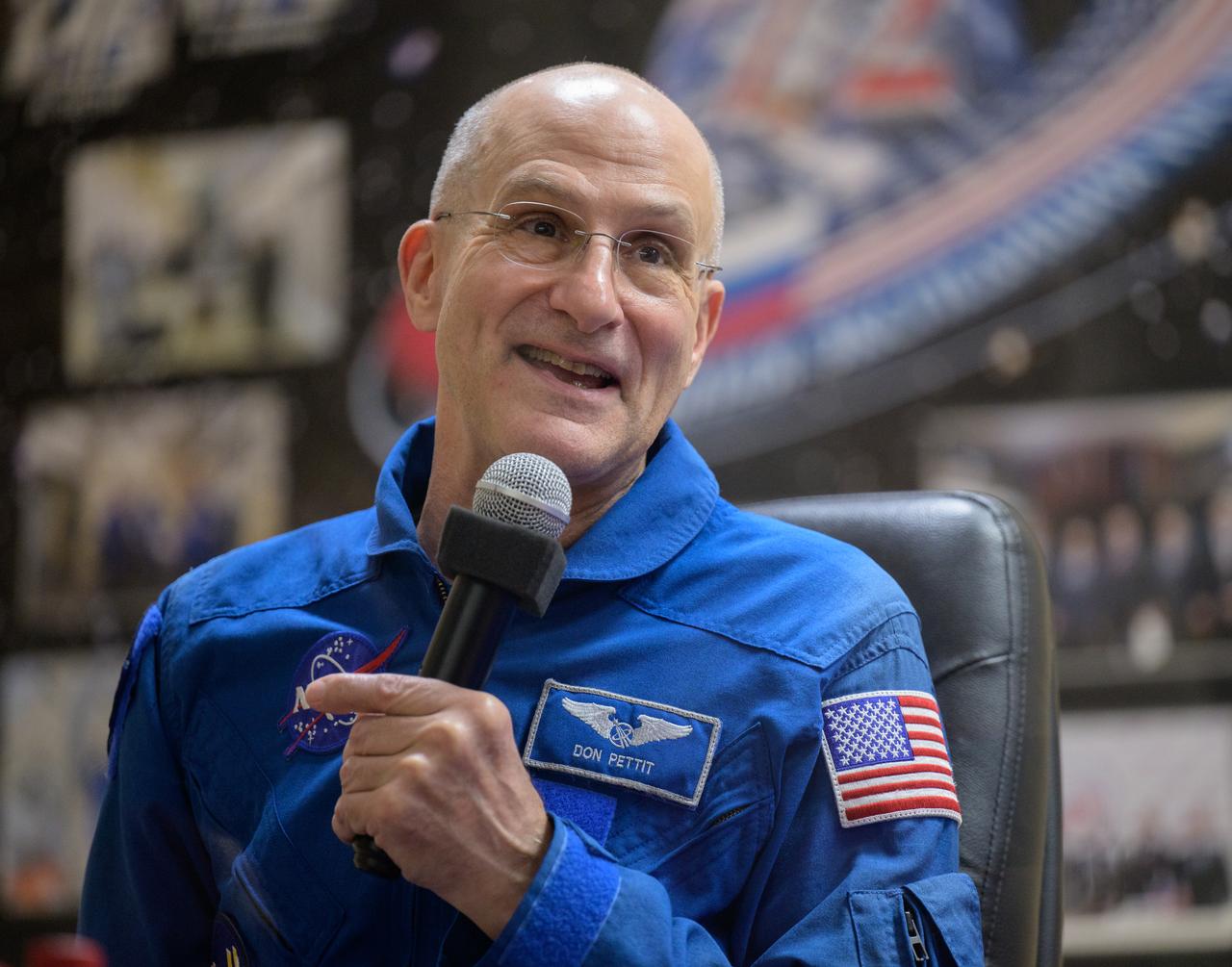 NASA astronaut Don Pettit is seen in quarantine, behind glass, during a press conference, Tuesday, Sept. 10, 2024 a the Cosmonaut Hotel in Baikonur, Kazakhstan. Expedition 72 crew members: NASA astronaut Don Pettit, Roscosmos cosmonauts Alexey Ovchinin, and Ivan Vagner, are scheduled to launch aboard their Soyuz MS-26 spacecraft on September 11. Photo Credit: (NASA/Bill Ingalls)