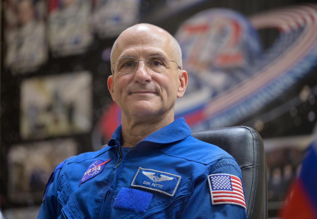 NASA astronaut Don Pettit is seen in quarantine, behind glass, during a press conference, Tuesday, Sept. 10, 2024 a the Cosmonaut Hotel in Baikonur, Kazakhstan. Expedition 72 crew members: NASA astronaut Don Pettit, Roscosmos cosmonauts Alexey Ovchinin, and Ivan Vagner, are scheduled to launch aboard their Soyuz MS-26 spacecraft on September 11. Photo Credit: (NASA/Bill Ingalls)