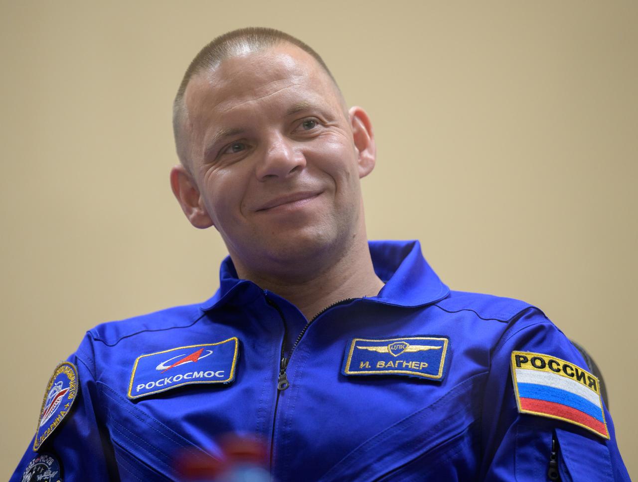 Roscosmos cosmonaut Ivan Vagner is seen in quarantine, behind glass, during a press conference, Tuesday, Sept. 10, 2024 a the Cosmonaut Hotel in Baikonur, Kazakhstan. Expedition 72 crew members: NASA astronaut Don Pettit, Roscosmos cosmonauts Alexey Ovchinin, and Ivan Vagner, are scheduled to launch aboard their Soyuz MS-26 spacecraft on September 11. Photo Credit: (NASA/Bill Ingalls)