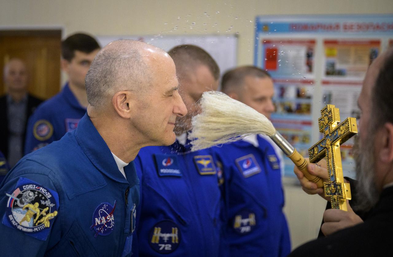 NASA astronaut Don Pettit receives the traditional blessing at the Cosmonaut Hotel prior to departing for suit-up and launch on a Soyuz rocket with fellow crew mates, Roscosmos cosmonauts Alexey Ovchinin, and Ivan Vagner, Wednesday, Sept. 11, 2024, in Baikonur, Kazakhstan. The launch will send Pettit, Ovchinin, and Vagner on a mission to the International Space Station. Photo Credit: (NASA/Bill Ingalls)