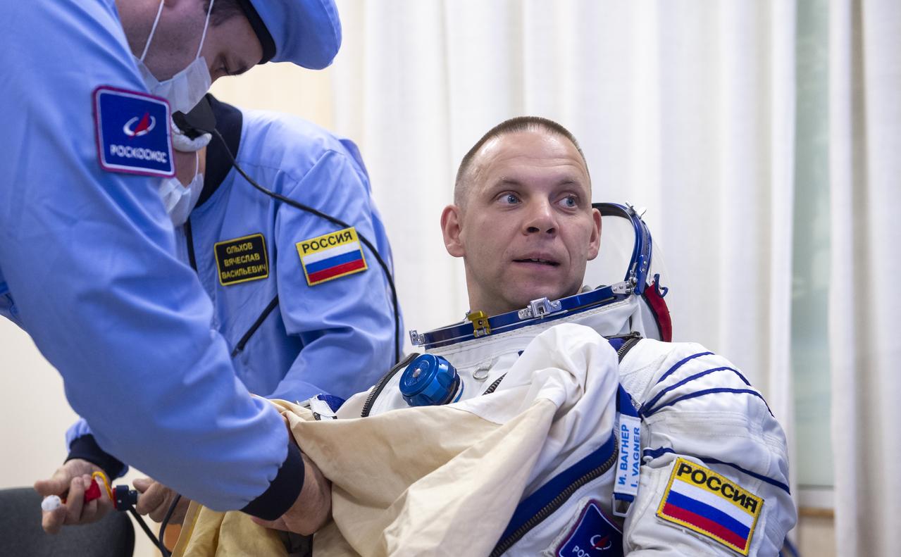 Roscosmos cosmonaut Ivan Vagner is helped into his Russian Sokol suit as he and fellow crew mates, Roscosmos cosmonaut Alexey Ovchinin, and NASA astronaut Don Pettit, prepare for their Soyuz launch to the International Space Station Wednesday, Sept. 11, 2024 in Baikonur, Kazakhstan. The launch will send Pettit, Ovchinin, and Vagner on a mission to the International Space Station. Photo Credit: (NASA/GCTC/Andrey Shelepin)