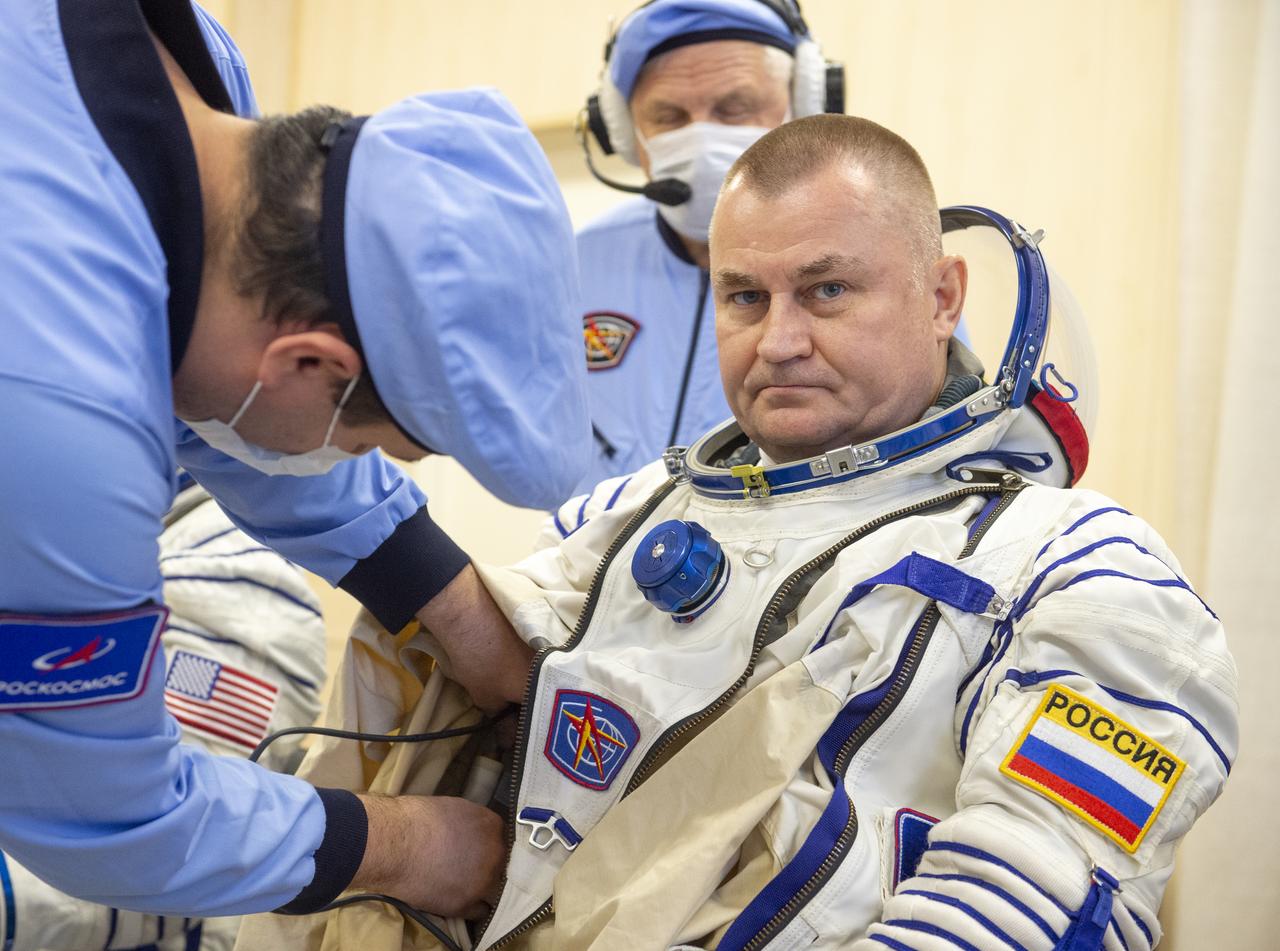 Roscosmos cosmonaut Alexey Ovchinin is helped into his Russian Sokol suit as he and fellow crew mates, NASA astronaut Don Pettit, and Roscosmos cosmonaut Ivan Vagner, prepare for their Soyuz launch to the International Space Station Wednesday, Sept. 11, 2024 in Baikonur, Kazakhstan. The launch will send Pettit, Ovchinin, and Vagner on a mission to the International Space Station. Photo Credit: (NASA/GCTC/Andrey Shelepin)