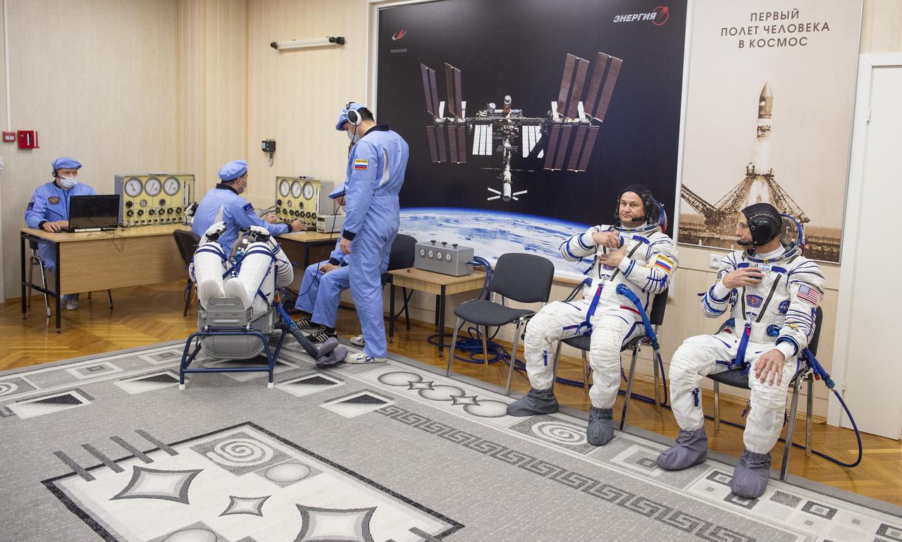 Roscosmos cosmonaut Ivan Vagner, left, has his Russian Sokol suit pressure checked as he and fellow crew mates, Roscosmos cosmonaut Alexey Ovchinin, and NASA astronaut Don Pettit, right, prepare for their Soyuz launch to the International Space Station Wednesday, Sept. 11, 2024 in Baikonur, Kazakhstan. The launch will send Pettit, Ovchinin, and Vagner on a mission to the International Space Station. Photo Credit: (NASA/GCTC/Andrey Shelepin)