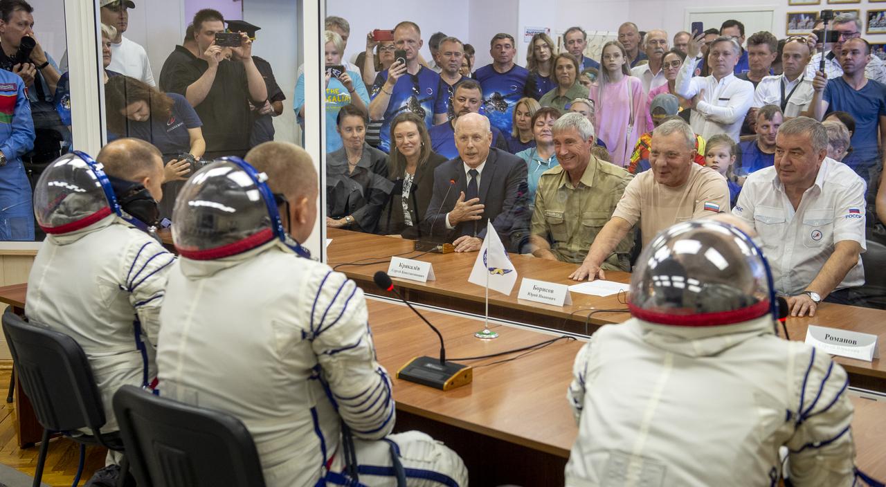Expedition 72 crew members: NASA astronaut Don Pettit, left, Roscosmos cosmonauts Alexey Ovchinin, center, and Ivan Vagner, talk to NASA and Roscosmos mission management and family ahead of their Soyuz launch to the International Space Station Wednesday, Sept. 11, 2024 in Baikonur, Kazakhstan. The launch will send Pettit, Ovchinin, and Vagner on a mission to the International Space Station. Photo Credit: (NASA/GCTC/Andrey Shelepin)