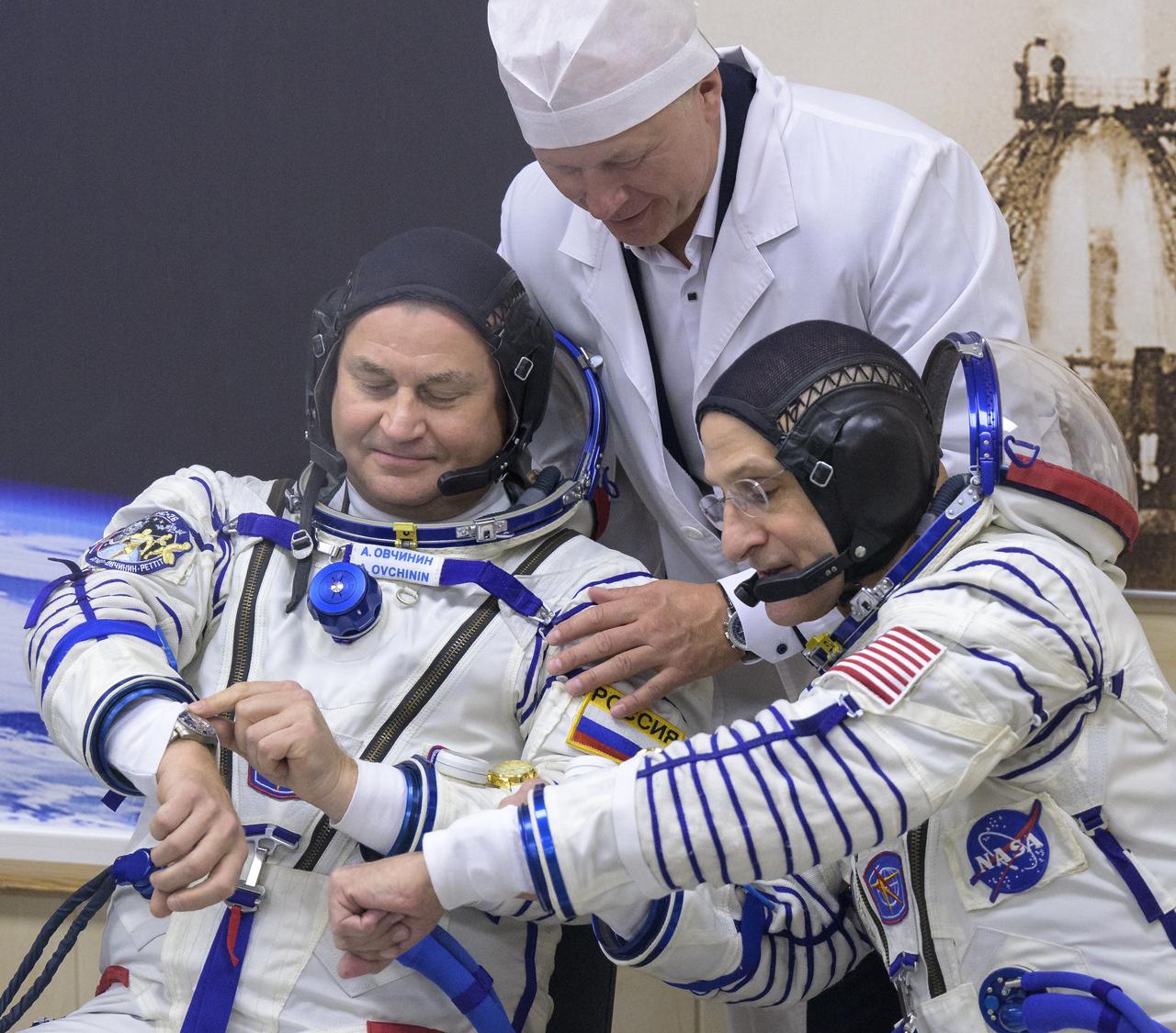 Roscosmos cosmonaut Alexey Ovchinin, left, and NASA astronaut Don Pettit, are seen talking with Roscosmos cosmonaut Oleg Novitsky, as they prepare to have their Russian Sokol suits pressure checked as they and fellow crew mate, Roscosmos cosmonaut Ivan Vagner, prepare for their Soyuz launch to the International Space Station Wednesday, Sept. 11, 2024 in Baikonur, Kazakhstan. The launch will send Pettit, Ovchinin, and Vagner on a mission to the International Space Station. Photo Credit: (NASA/Bill Ingalls)