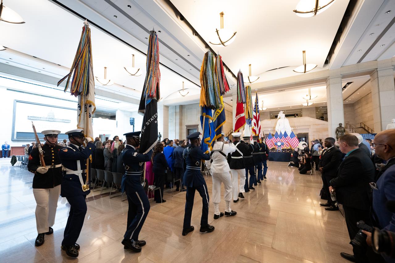 The United States Joint Armed Forces Color Guard presents the colors during a Congressional Gold Medal ceremony recognizing NASA’s Hidden Figures, Wednesday, Sept. 18, 2024, in Emancipation Hall at the U.S. Capitol in Washington. Congressional Gold Medals were awarded to Katherine Johnson, Dr. Christine Darden, Dorothy Vaughan, and Mary W. Jackson in recognition of their service to the United States as well as a Congressional Gold Medal in recognition of all the women who served as computers, mathematicians, and engineers at the National Advisory Committee for Aeronautics and NASA between the 1930s and 1970s.  Photo Credit: (NASA/Joel Kowsky)