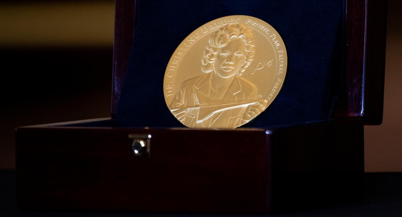 The Congressional Gold Medal for Dr. Christine Darden for her service to the United States as an aeronautical engineer is seen during a ceremony recognizing NASA’s Hidden Figures, Wednesday, Sept. 18, 2024, in Emancipation Hall at the U.S. Capitol in Washington. Congressional Gold Medals were awarded to Katherine Johnson, Dr. Christine Darden, Dorothy Vaughan, and Mary W. Jackson in recognition of their service to the United States as well as a Congressional Gold Medal in recognition of all the women who served as computers, mathematicians, and engineers at the National Advisory Committee for Aeronautics and NASA between the 1930s and 1970s.  Photo Credit: (NASA/Joel Kowsky)