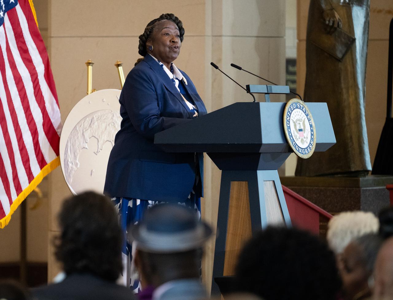 Andrea Mosie, Apollo Sample Lead Processor at NASA's Johnson Space Center, delivers remarks during a Congressional Gold Medal ceremony recognizing NASA’s Hidden Figures, Wednesday, Sept. 18, 2024, in Emancipation Hall at the U.S. Capitol in Washington. Congressional Gold Medals were awarded to Katherine Johnson, Dr. Christine Darden, Dorothy Vaughan, and Mary W. Jackson in recognition of their service to the United States as well as a Congressional Gold Medal in recognition of all the women who served as computers, mathematicians, and engineers at the National Advisory Committee for Aeronautics and NASA between the 1930s and 1970s.  Photo Credit: (NASA/Joel Kowsky)