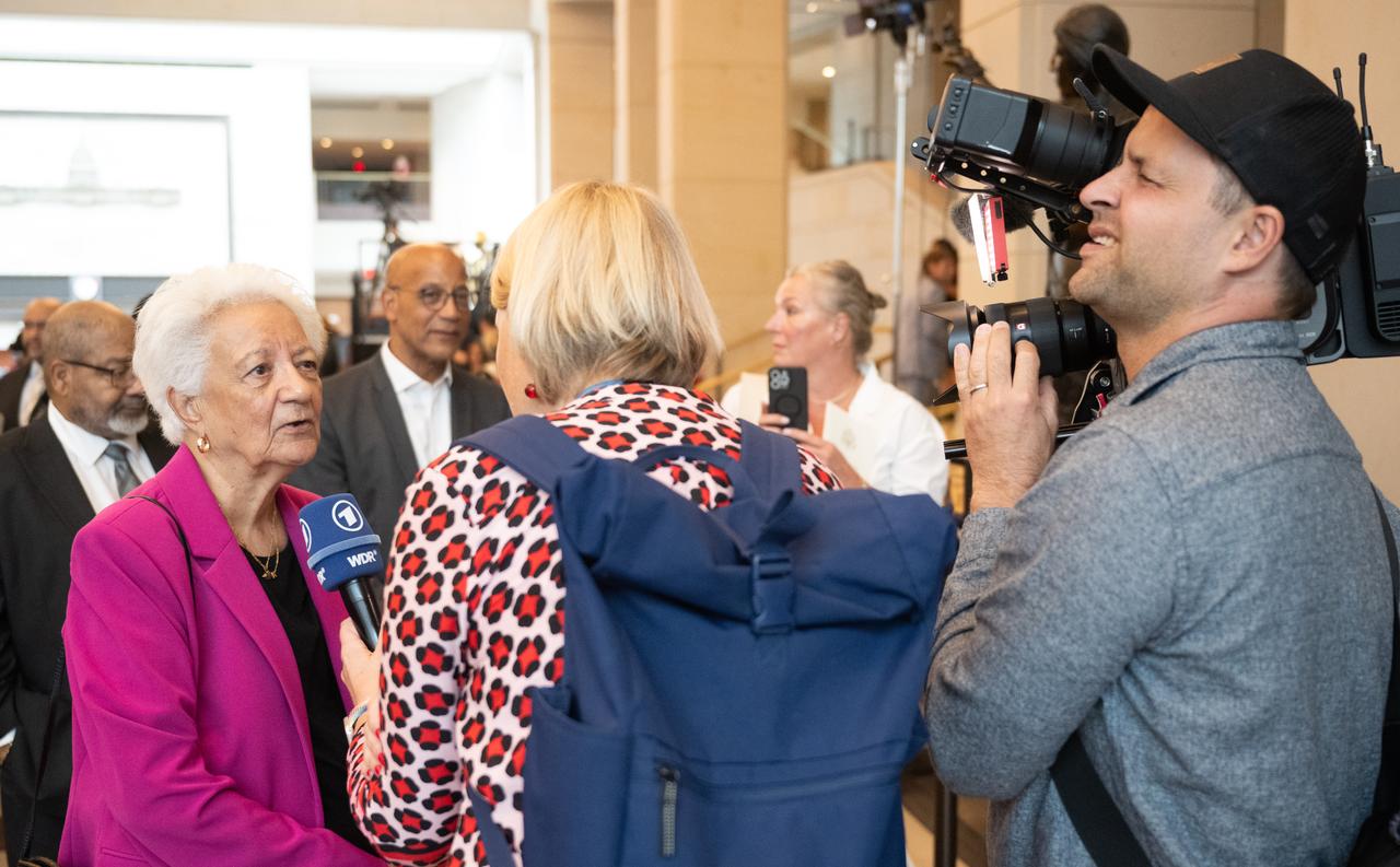 Ann Hammond, daughter of Dorothy Vaughan, speaks with a member of the media following a Congressional Gold Medal ceremony recognizing NASA’s Hidden Figures, Wednesday, Sept. 18, 2024, in Emancipation Hall at the U.S. Capitol in Washington. Congressional Gold Medals were awarded to Katherine Johnson, Dr. Christine Darden, Dorothy Vaughan, and Mary W. Jackson in recognition of their service to the United States as well as a Congressional Gold Medal in recognition of all the women who served as computers, mathematicians, and engineers at the National Advisory Committee for Aeronautics and NASA between the 1930s and 1970s.  Photo Credit: (NASA/Joel Kowsky)