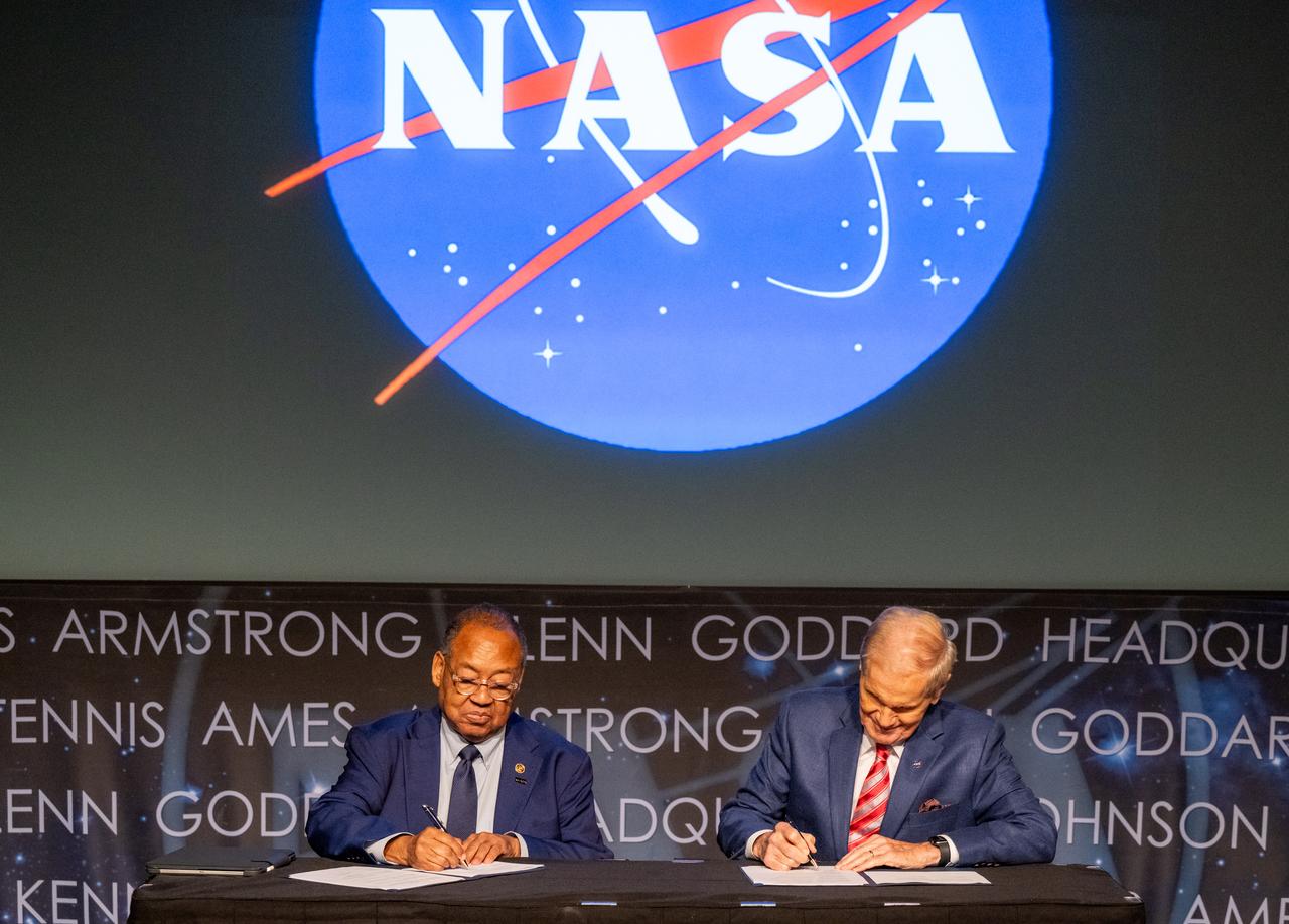 NAACP Board Chair Leon Russell, left, and NASA Administrator Bill Nelson, right, sign a Space Act Agreement between NASA and the NAACP during a 5th Annual Hidden Figures Street Naming Anniversary event Thursday, Sept. 19, 2024, at the Mary W. Jackson NASA Headquarters building in Washington.  Photo Credit: (NASA/Keegan Barber)