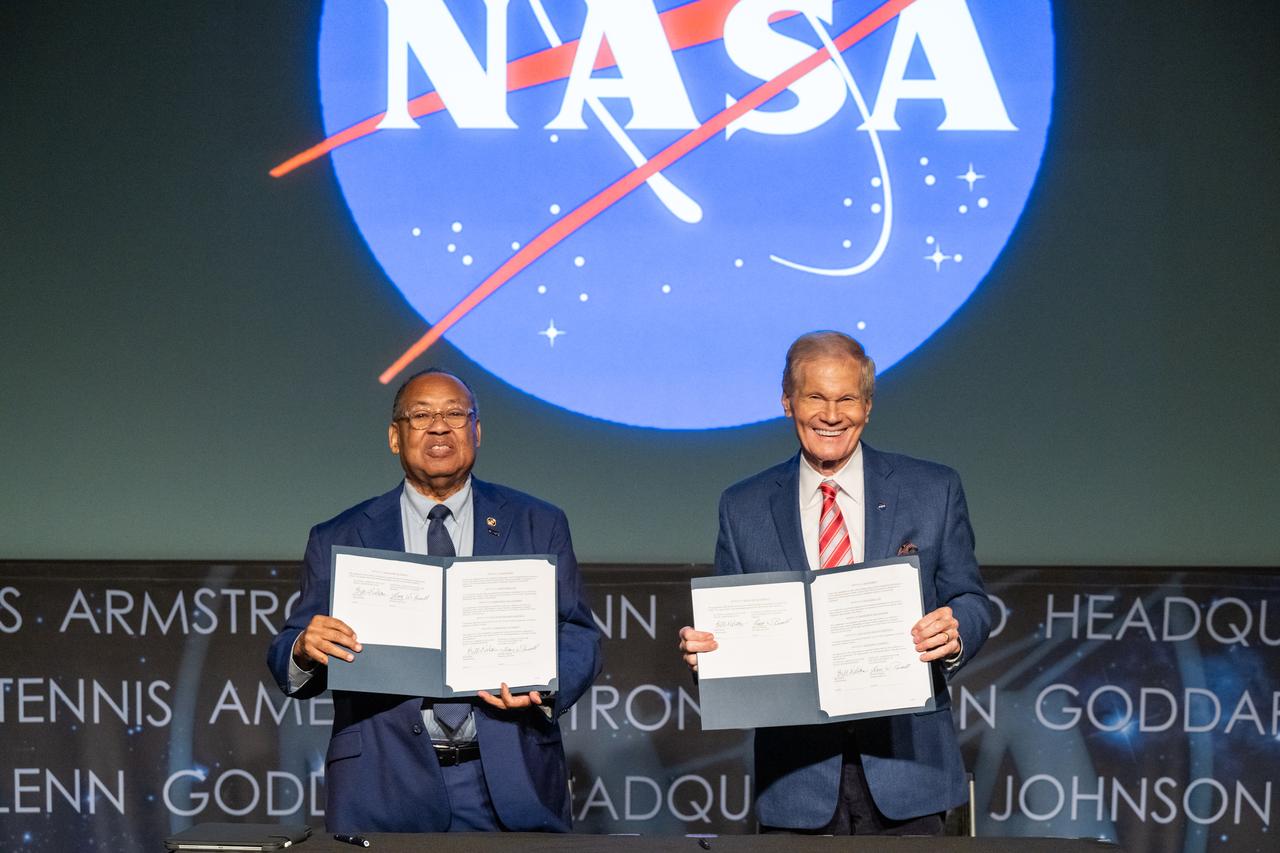 NAACP Board Chair Leon Russell, left, and NASA Administrator Bill Nelson, right, sign a Space Act Agreement between NASA and the NAACP during a 5th Annual Hidden Figures Street Naming Anniversary event Thursday, Sept. 19, 2024, at the Mary W. Jackson NASA Headquarters building in Washington.  Photo Credit: (NASA/Keegan Barber)