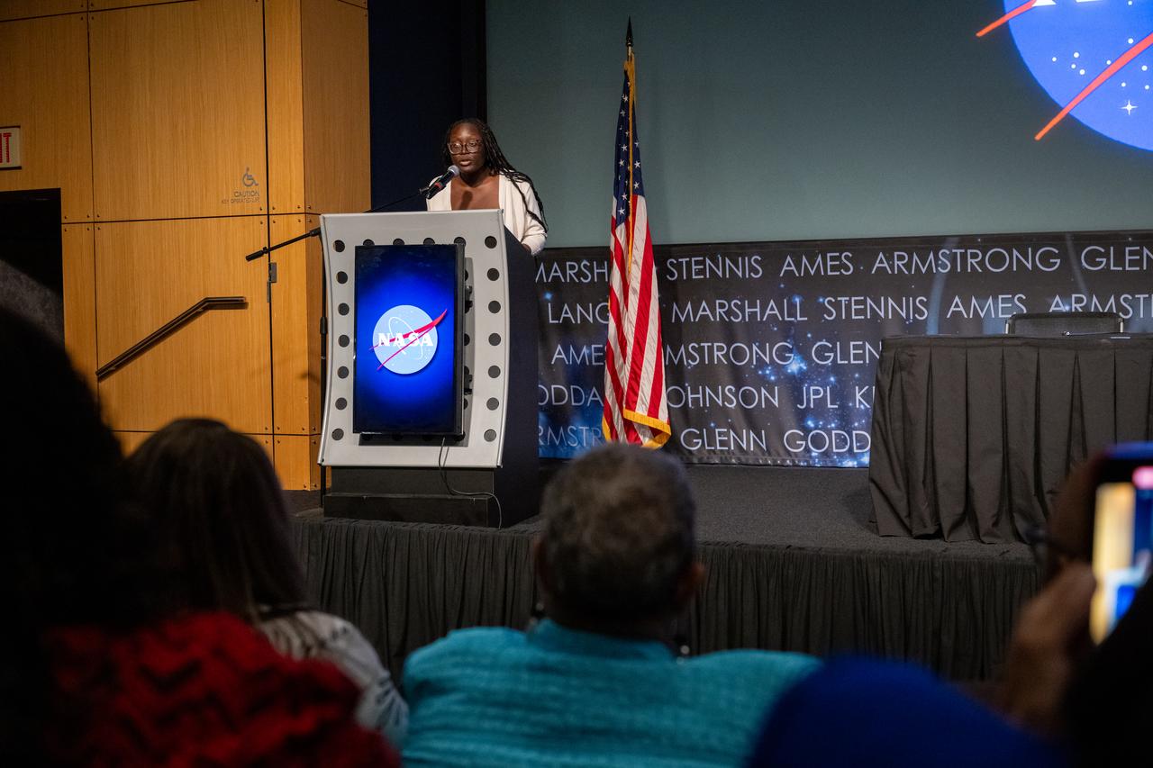 Brainy Akpala recites her poem “Sitting Upon Flames” during a 5th Annual Hidden Figures Street Naming Anniversary event Thursday, Sept. 19, 2024, at the Mary W. Jackson NASA Headquarters building in Washington. Photo Credit: (NASA/Keegan Barber)