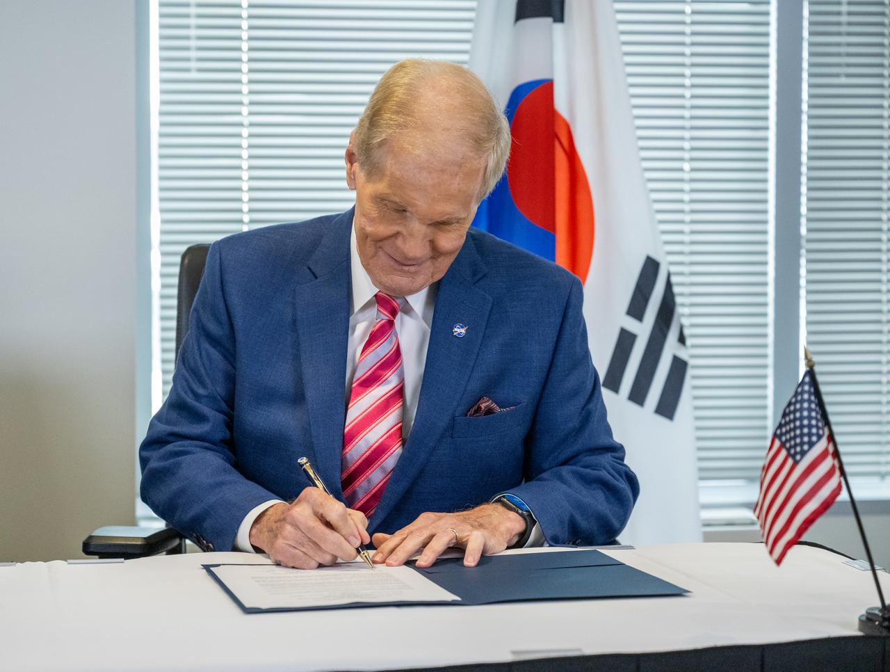 NASA Administrator Bill Nelson signs a Joint Statement with Korea AeroSpace Administration (KASA) Administrator Youngbin Yoon following a bilateral meeting Thursday, Sept. 19, 2024, at the Mary W. Jackson NASA Headquarters building in Washington.  Photo Credit: (NASA/Keegan Barber)