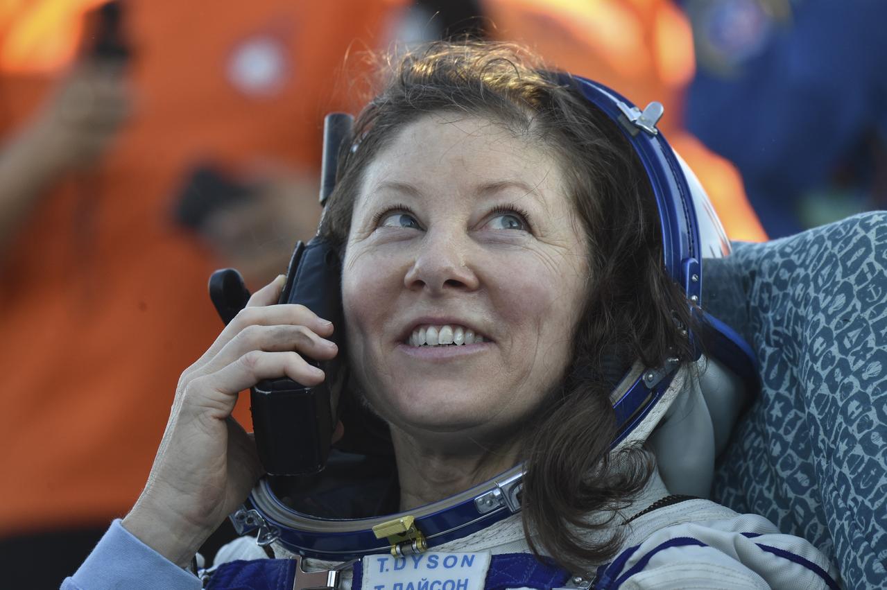 NASA astronaut Tracy C. Dyson is seen outside the Soyuz MS-25 spacecraft talking with friends and family via satellite phone after she landed with Roscosmos cosmonauts Oleg Kononenko and Nikolai Chub, in a remote area near the town of Zhezkazgan, Kazakhstan on Monday, Sept. 23, 2024. Dyson is returning to Earth after logging 184 days in space as a member of Expeditions 70-71 aboard the International Space Station and Chub and Kononenko return after having spent the last 374 days in space. Photo Credit NASA/GCTC/Pavel Shvets