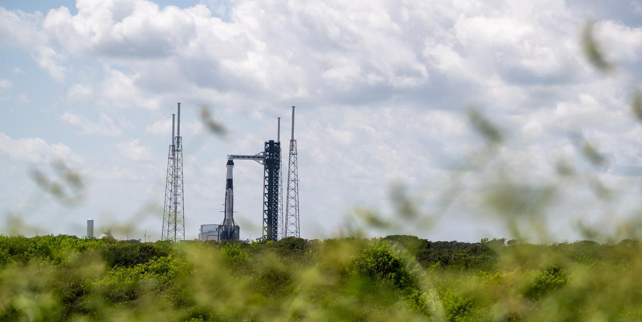 A SpaceX Falcon 9 rocket with the company's Dragon spacecraft on top is seen on the launch pad at Space Launch Complex 40 as preparations continue for the Crew-9 mission, Tuesday, Sept. 24, 2024, at Cape Canaveral Space Force Station in Florida. NASA’s SpaceX Crew-9 mission is the ninth crew rotation mission of the SpaceX Dragon spacecraft and Falcon 9 rocket to the International Space Station as part of the agency’s Commercial Crew Program. Photo Credit: (NASA/Keegan Barber)