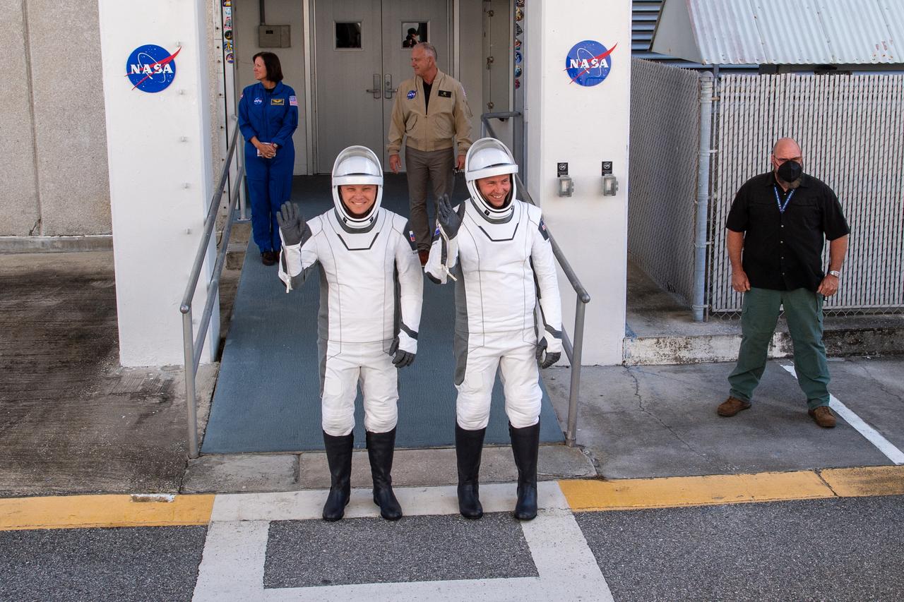 Roscosmos cosmonaut Aleksandr Gorbunov, left, and NASA astronaut Nick Hague, right, wearing SpaceX spacesuits, are seen as they depart the Neil A. Armstrong Operations and Checkout Building for Space Launch Complex 40 on Cape Canaveral Space Force Station during a dress rehearsal in preparation for the Crew-9 mission launch, Tuesday, Sept. 24, 2024, at NASA’s Kennedy Space Center in Florida. NASA’s SpaceX Crew-9 mission is the ninth crew rotation mission of the SpaceX Dragon spacecraft and Falcon 9 rocket to the International Space Station as part of the agency’s Commercial Crew Program. Photo Credit: (NASA/Keegan Barber)