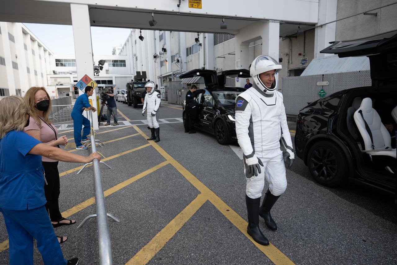 NASA astronaut Nick Hague and Roscosmos cosmonaut Aleksandr Gorbunov, wearing SpaceX spacesuits, are seen as they depart the Neil A. Armstrong Operations and Checkout Building for Space Launch Complex 40 on Cape Canaveral Space Force Station during a dress rehearsal in preparation for the Crew-9 mission launch, Tuesday, Sept. 24, 2024, at NASA’s Kennedy Space Center in Florida. NASA’s SpaceX Crew-9 mission is the ninth crew rotation mission of the SpaceX Dragon spacecraft and Falcon 9 rocket to the International Space Station as part of the agency’s Commercial Crew Program. Photo Credit: (NASA/Keegan Barber)