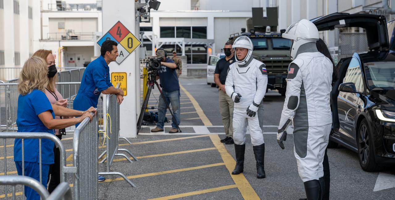 NASA astronaut Nick Hague and Roscosmos cosmonaut Aleksandr Gorbunov, wearing SpaceX spacesuits, are seen as they depart the Neil A. Armstrong Operations and Checkout Building for Space Launch Complex 40 on Cape Canaveral Space Force Station during a dress rehearsal in preparation for the Crew-9 mission launch, Tuesday, Sept. 24, 2024, at NASA’s Kennedy Space Center in Florida. NASA’s SpaceX Crew-9 mission is the ninth crew rotation mission of the SpaceX Dragon spacecraft and Falcon 9 rocket to the International Space Station as part of the agency’s Commercial Crew Program. Photo Credit: (NASA/Keegan Barber)