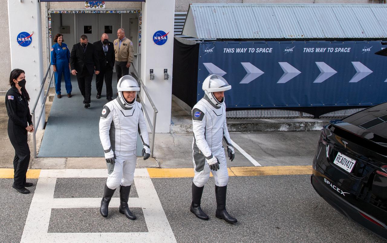 Roscosmos cosmonaut Aleksandr Gorbunov, left, and NASA astronaut Nick Hague, right, wearing SpaceX spacesuits, are seen as they prepare to depart the Neil A. Armstrong Operations and Checkout Building for Space Launch Complex 40 on Cape Canaveral Space Force Station to board the SpaceX Dragon spacecraft for the Crew-9 mission launch, Saturday, Sept. 28, 2024, at NASA’s Kennedy Space Center in Florida. NASA’s SpaceX Crew-9 mission is the ninth crew rotation mission of the SpaceX Dragon spacecraft and Falcon 9 rocket to the International Space Station as part of the agency’s Commercial Crew Program. Hague and Gorbunov are scheduled to launch at 1:17 p.m. EDT, from Space Launch Complex 40 at the Cape Canaveral Space Force Station. Photo Credit: (NASA/Keegan Barber)
