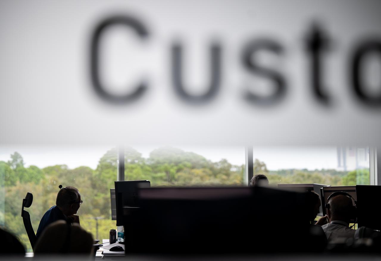 Staff monitor the countdown of the launch of a SpaceX Falcon 9 rocket carrying the company's Dragon spacecraft on NASA’s SpaceX Crew-9 mission with NASA astronaut Nick Hague and Roscosmos cosmonaut Aleksandr Gorbunov onboard, Saturday, Sept. 28, 2024, in the control center of SpaceX’s HangarX at NASA’s Kennedy Space Center in Florida. NASA’s SpaceX Crew-9 mission is the ninth crew rotation mission of the SpaceX Dragon spacecraft and Falcon 9 rocket to the International Space Station as part of the agency’s Commercial Crew Program. Hague and Gorbunov are scheduled to launch at 1:17 p.m. EDT, from Space Launch Complex 40 at the Cape Canaveral Space Force Station. Photo Credit: (NASA/Keegan Barber)