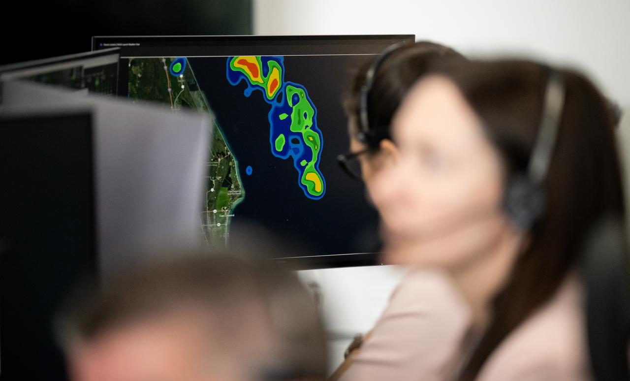Staff monitor weather patterns during the countdown of the launch of a SpaceX Falcon 9 rocket carrying the company's Dragon spacecraft on NASA’s SpaceX Crew-9 mission with NASA astronaut Nick Hague and Roscosmos cosmonaut Aleksandr Gorbunov onboard, Saturday, Sept. 28, 2024, in the control center of SpaceX’s HangarX at NASA’s Kennedy Space Center in Florida. NASA’s SpaceX Crew-9 mission is the ninth crew rotation mission of the SpaceX Dragon spacecraft and Falcon 9 rocket to the International Space Station as part of the agency’s Commercial Crew Program. Hague and Gorbunov are scheduled to launch at 1:17 p.m. EDT, from Space Launch Complex 40 at the Cape Canaveral Space Force Station. Photo Credit: (NASA/Keegan Barber)
