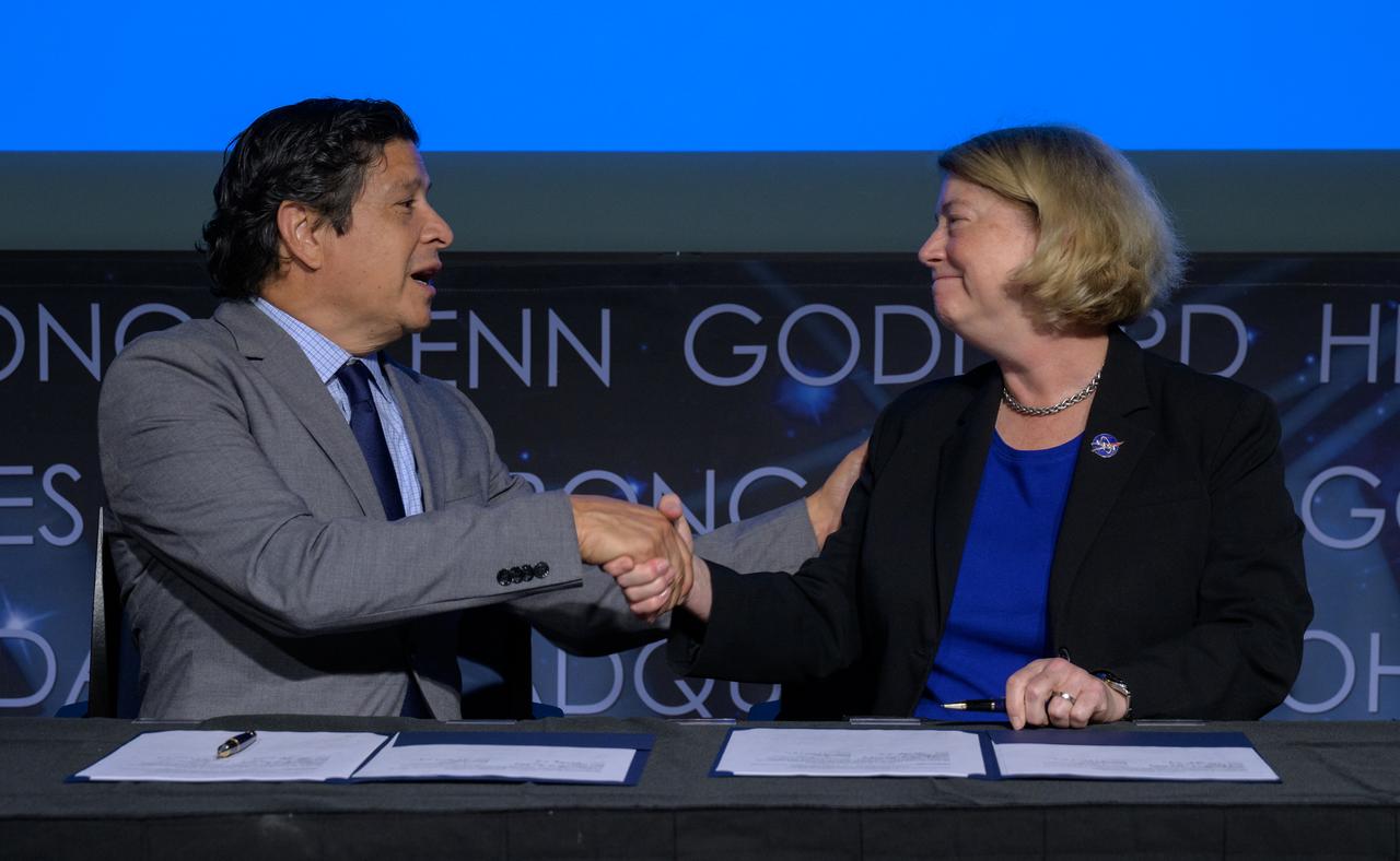President and CEO of the Hispanic Heritage Foundation Jose Antonio Tijerino, left, and NASA Deputy Administrator Pam Melroy, shake hands after signing a Space Act Agreement between the HHF and NASA to collaborate and expand STEM opportunities for Latino K-12 and university students and reduce barriers to agency activities and opportunities, Monday, Sept. 30, 2024, at the NASA Headquarters Mary W. Jackson Building in Washington. Photo Credit: (NASA/Bill Ingalls)