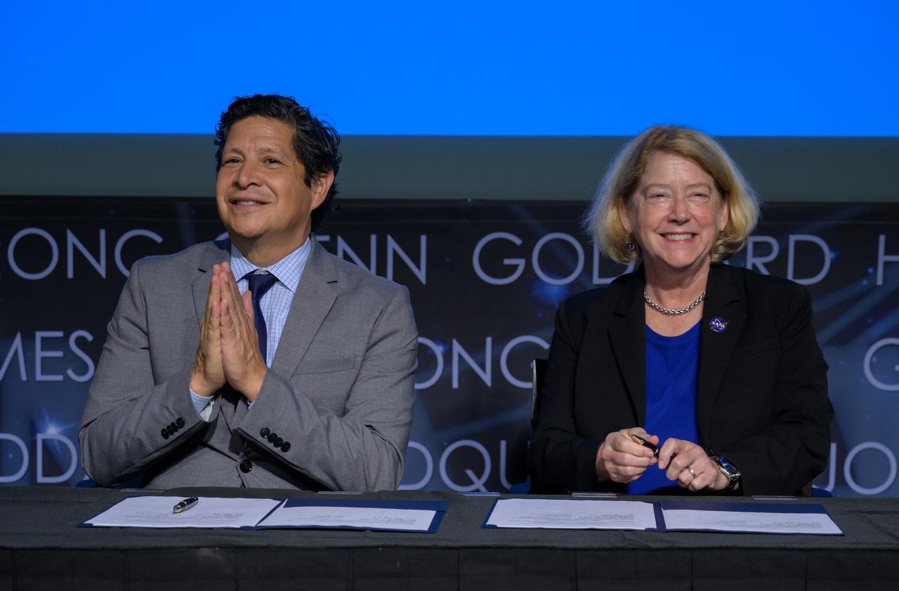 President and CEO of the Hispanic Heritage Foundation Jose Antonio Tijerino, left, and NASA Deputy Administrator Pam Melroy, react after signing a Space Act Agreement between the HHF and NASA to collaborate and expand STEM opportunities for Latino K-12 and university students and reduce barriers to agency activities and opportunities, Monday, Sept. 30, 2024, at the NASA Headquarters Mary W. Jackson Building in Washington. Photo Credit: (NASA/Bill Ingalls)