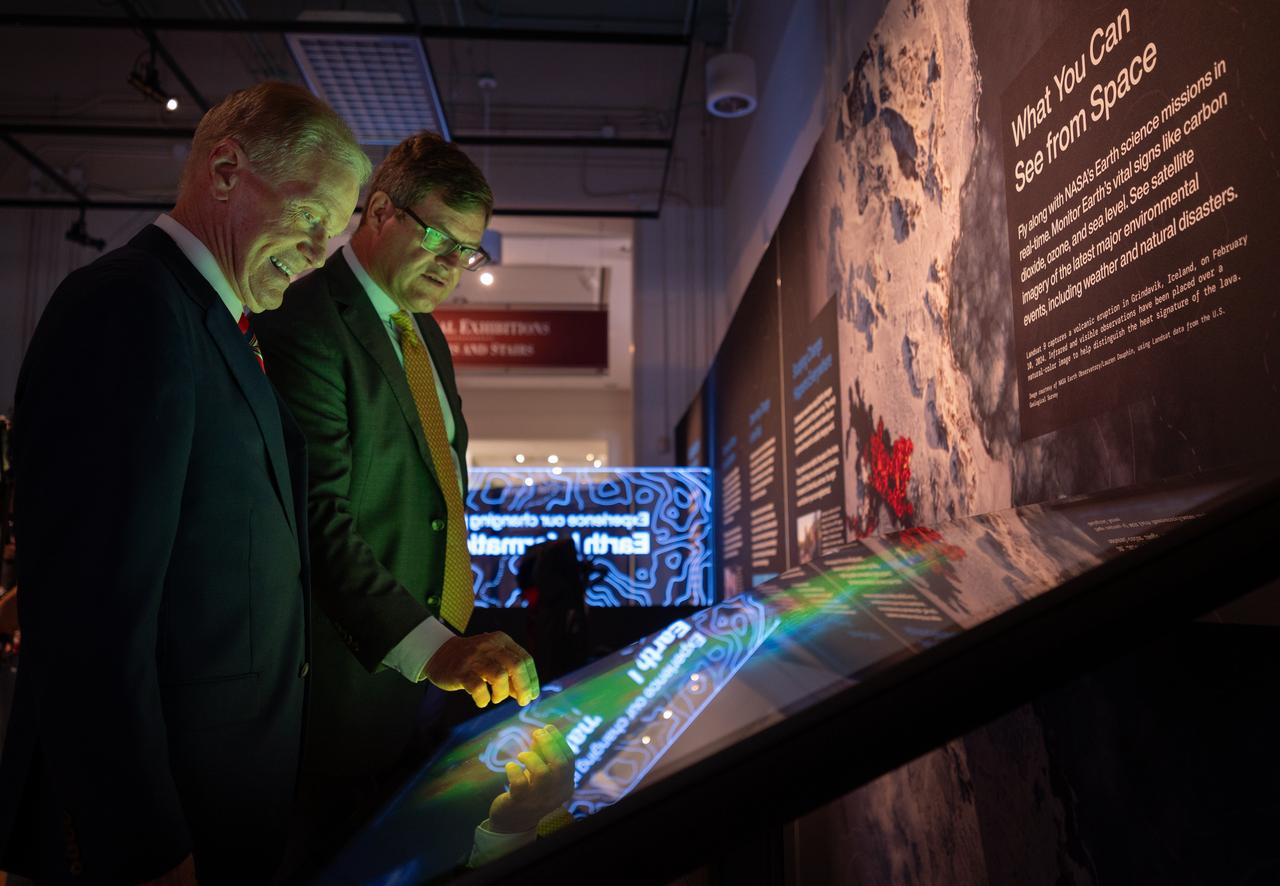 NASA Administrator Bill Nelson, left, and Smithsonian Museum of Natural History, Sant Director, Kirk Johnson, preview the Earth Information Center at the Smithsonian National Museum of Natural History, in Washington, Monday, Oct. 7, 2024. The exhibit includes a video wall displaying Earth science data visualizations and videos, an interpretive panel showing Earth’s connected systems, information on our changing world, and an overview of how NASA and the Smithsonian study our home planet. Photo Credit: (NASA/Bill Ingalls)