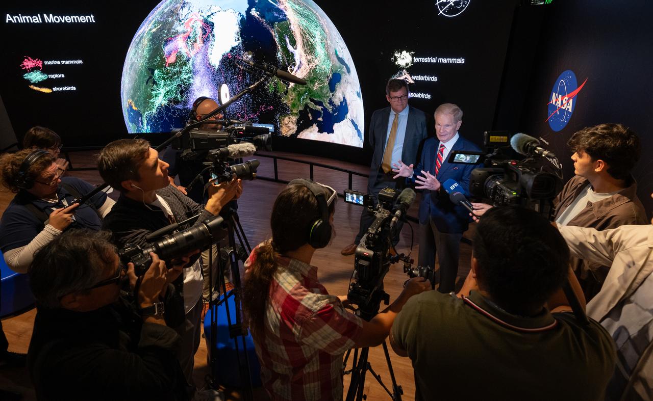 Smithsonian Museum of Natural History, Sant Director, Kirk Johnson, left, and NASA Administrator Bill Nelson, talk with media during a preview the Earth Information Center at the Smithsonian National Museum of Natural History, in Washington, Monday, Oct. 7, 2024. The exhibit includes a video wall displaying Earth science data visualizations and videos, an interpretive panel showing Earth’s connected systems, information on our changing world, and an overview of how NASA and the Smithsonian study our home planet. Photo Credit: (NASA/Bill Ingalls)