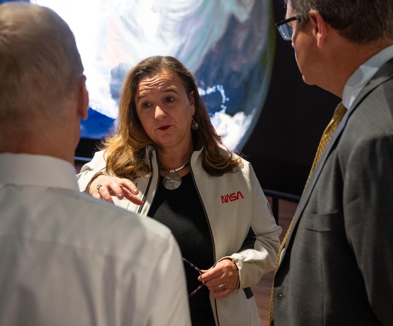 NASA Earth Sciences, Division Director, Karen St. Germain, center, speaks with NASA Administrator Bill Nelson, left, and Smithsonian Museum of Natural History, Sant Director, Kirk Johnson, during a preview of the Earth Information Center at the Smithsonian National Museum of Natural History, in Washington, Monday, Oct. 7, 2024. The exhibit includes a video wall displaying Earth science data visualizations and videos, an interpretive panel showing Earth’s connected systems, information on our changing world, and an overview of how NASA and the Smithsonian study our home planet. Photo Credit: (NASA/Bill Ingalls)
