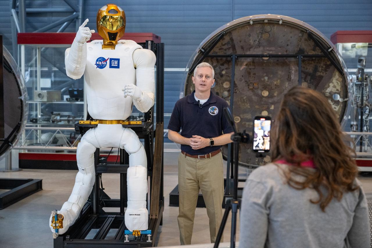 Jonathan Rogers, chief of the Robotic Systems Technology Branch at NASA’s Johnson Space Center and former Robonaut project manager, participates in a media opportunity at the Smithsonian National Air and Space Museum’s Steve F. Udvar-Hazy Center Thursday, Oct. 24, 2024, in Chantilly, Va. Robonaut 2, the first humanoid robot to fly to space, is displayed publicly for the first time near the space shuttle Discovery. Photo Credit: (NASA/Keegan Barber)