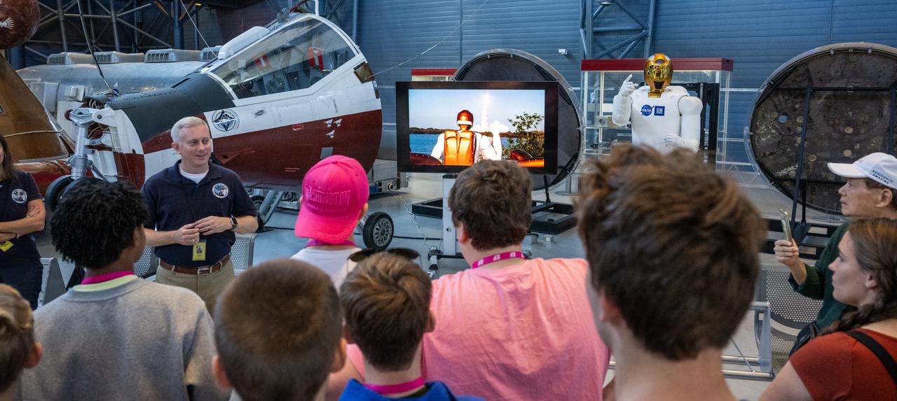 Jonathan Rogers, chief of the Robotic Systems Technology Branch at NASA’s Johnson Space Center and former Robonaut project manager, answers questions about Robonaut 2 from museum guests at the Smithsonian National Air and Space Museum’s Steve F. Udvar-Hazy Center Thursday, Oct. 24, 2024, in Chantilly, Va. Robonaut 2, the first humanoid robot to fly to space, is displayed publicly for the first time near the space shuttle Discovery. Photo Credit: (NASA/Keegan Barber)